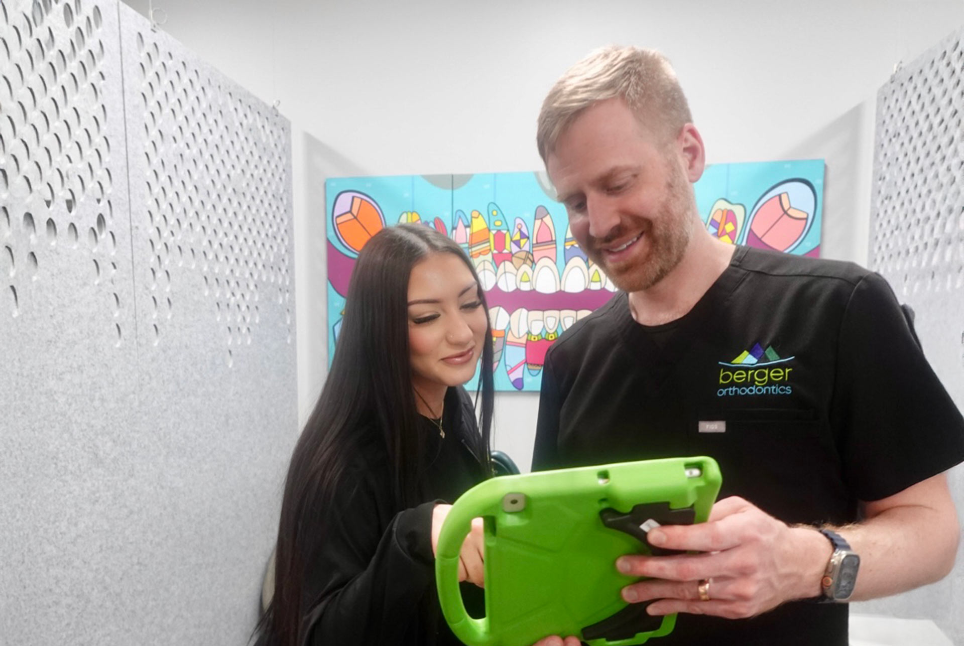 Dr. Berger with tech and ipad